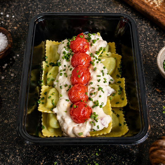Ravioli met spinazie en ricotta - romige spekjessaus - kerstomaten
